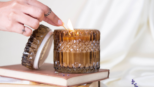 a person lighting scented candle