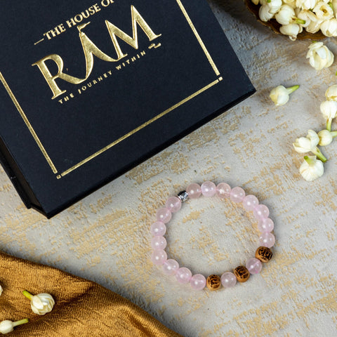 Rose quartz stone bracelet with ram engraved beads